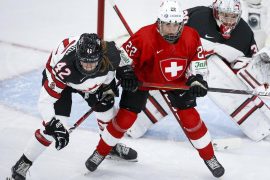 Spooner scored twice in women's hockey worlds for Canada in a 5–0 win over Switzerland.